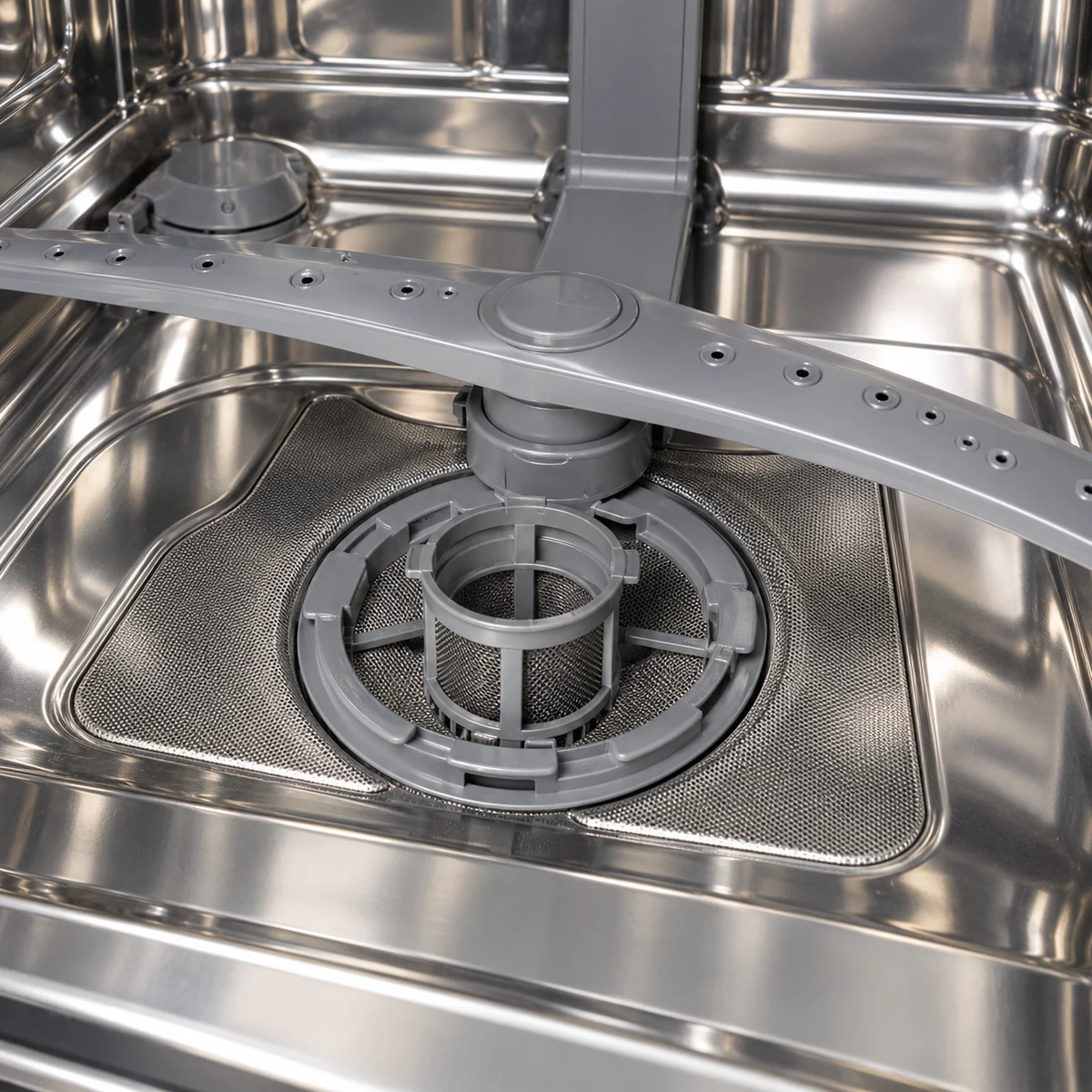 Clean round dishwasher filter seated securely in the bottom of the dishwasher tub